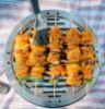 Basting kebabs on Cobb cooker BBQ Kit