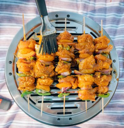 Basting kebabs on Cobb cooker BBQ Kit