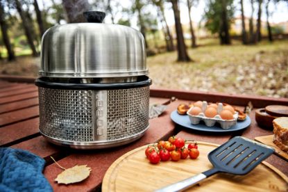 Cobb Premier Air portable charcoal cooker sitting on garden decking