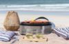 Cobb Supreme portable charcoal cooker grilling prawns at the beach